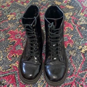 Shiny black combat boots